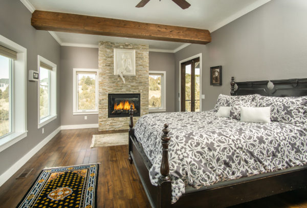 master bedroom with fireplace built by DM Builders, Idaho home construction